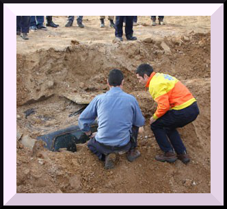 Firemen eventrually discover the buried car