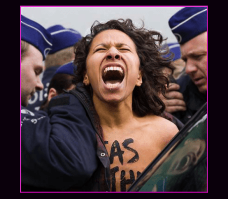 Police officers arrest an anti-Russian demonstrator from the group Femen outside of an emergency meeting of EU foreign ministers at the EU Council building in Brussels 