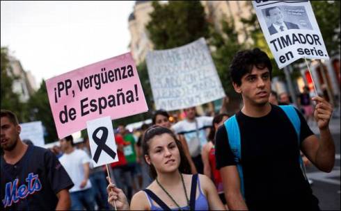 'PP Party the SHAME of SPAIN' and 'Rajoy the Swindler'