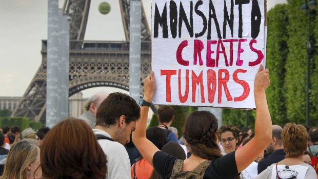 Demonstrators protest Monsanto Co. in Paris on May 23. The company says it will appeal a ruling by a French court that its herbicide Lasso poisoned a French farmer. (Mal Langsdon/Reuters)
