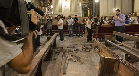 ….media circus inventing the shocking destruction after the ”bomb” which Monica and Fran are accused of planting in the Zaragoza Basilica, symbol of the Catholic/Fascist dictatorship…