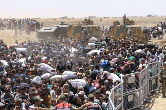 https://thefreeonline.com/wp-content/uploads/2016/05/syrians-wait-at-the-syrian-side-of-the-turkish-syrian-borderline.