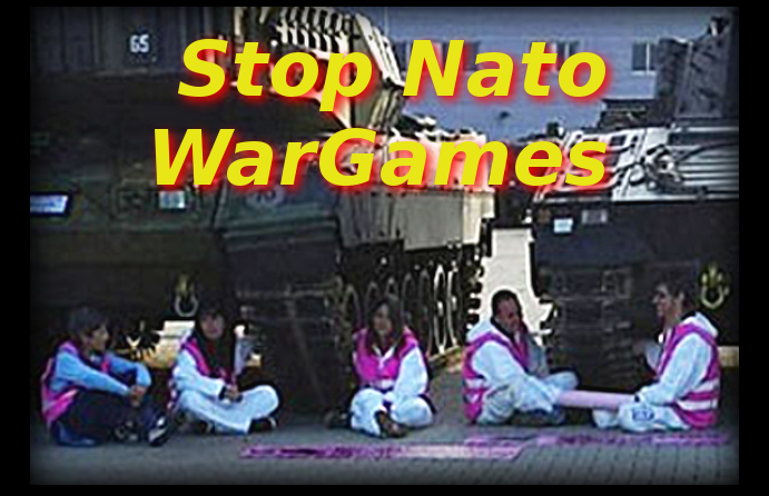 Anti Nato protestors chain themselves under war game tanks, Spain 2016.