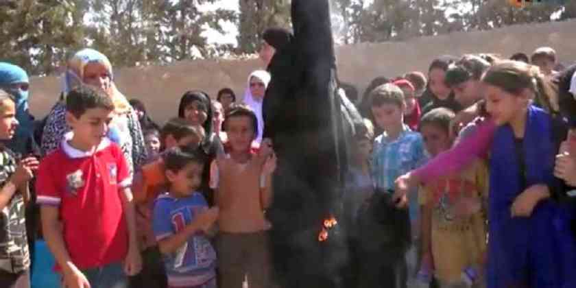 Syrian-women-burn-burkas-to-celebrate-liberation-from-Isil-in-Manbij-Syria