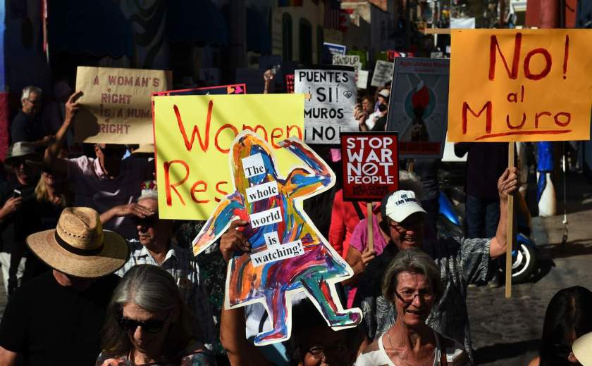 People take part in the "Women's March" in Ajijic -a city with a large community of US and Canandian nationals, mainly retired-, Jalisco state, Mexico on January 21, 2017. The rally took place in solidarity with the Women's March summoned in the United States one day after the inauguration of President Donald Trump. / AFP PHOTO / HECTOR GUERREROHECTOR GUERRERO/AFP/Getty Images NYTCREDIT: Hector Guerrero/Agence France-Presse -- Getty Images