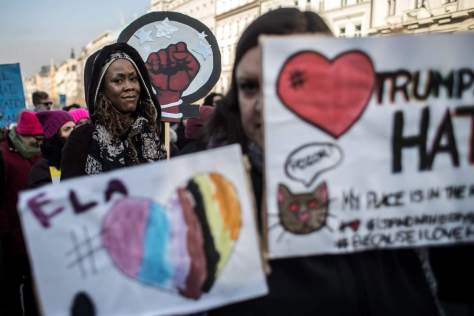 epa05738284 People hold banners as they attend 'Love Trumps Hate' rally, an official sister protest to the Women's March in Washington, in Prague, Czech Republic, 21 January 2017. Protest rallies were held in over 30 countries around the world in solidarity with the Women's March on Washington in defense of press freedom, women's and human rights following the official inauguration of Donald J. Trump as the 45th President of the United States of America in Washington, DC, USA, on 20 January 2017. EPA/MARTIN DIVISEK NYTCREDIT: Martin Divisek/European Pressphoto Agency