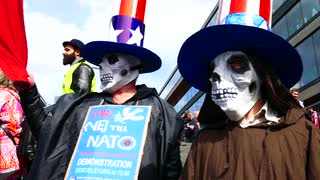 stockholm-sweden-may-2016-crowd-of-people-participating-in-anti-war-anti-nato-no-to-war-demonstrations-carrying-signs-against-barack-obama-and-nato-is-war-on-21-may-sergels-torg-central-stockholm_r53v